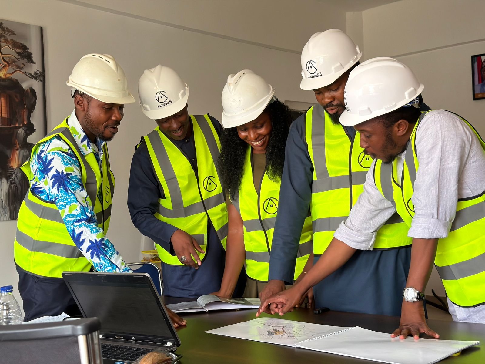 Engineering team reviewing technical documentation together