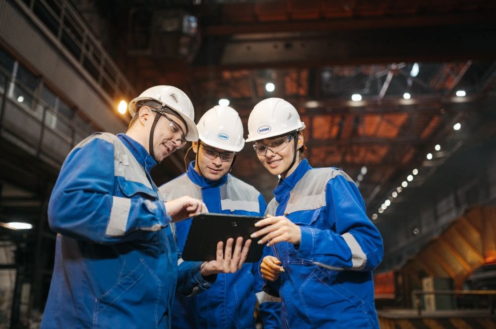 Industrial engineers reviewing equipment in a factory