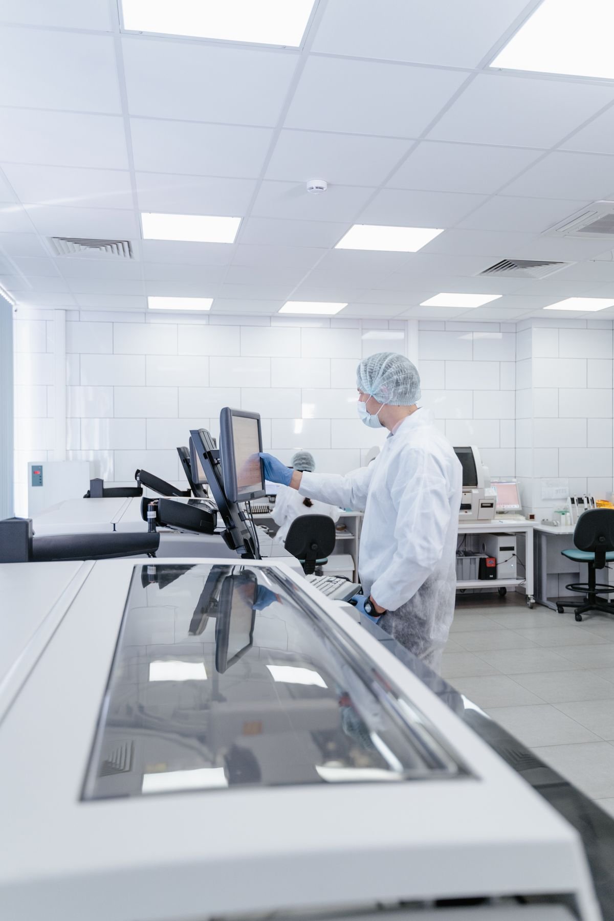 Technician carrying out particle count testing with a particle counter