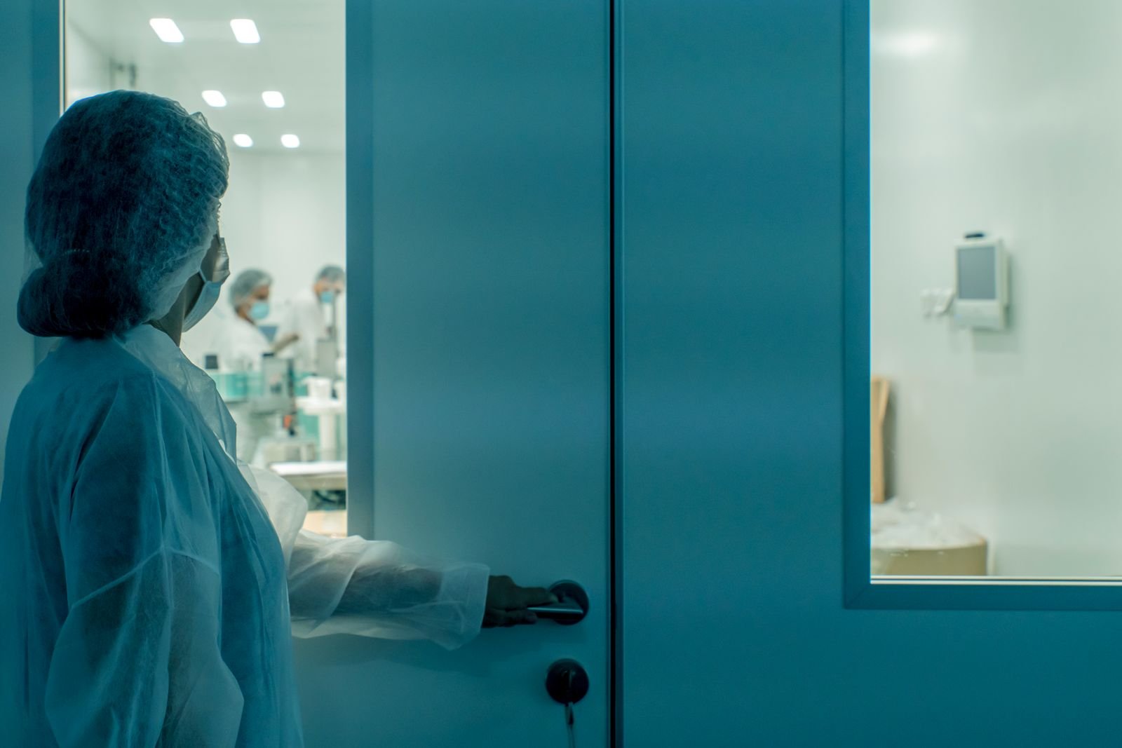 Technician carrying out baseline qualification testing in a newly commissioned cleanroom